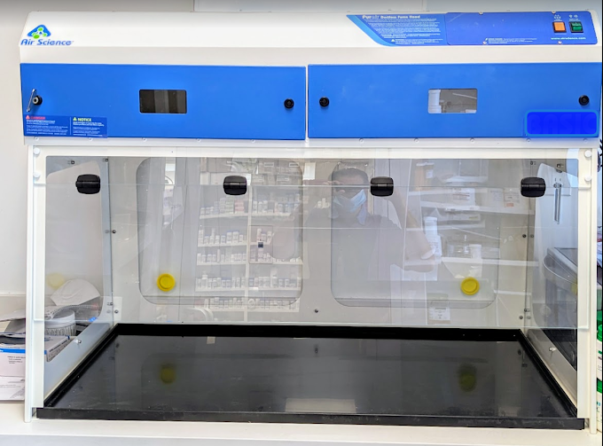 Humber Bay Pharmacy's Level C hazardous compounding facility in Etobicoke, Ontario. Features negative pressure room, double HEPA filtration, and certified containment hood for safe handling of chemotherapy, hormones, and high-risk medications. OCP and NAPRA compliant.